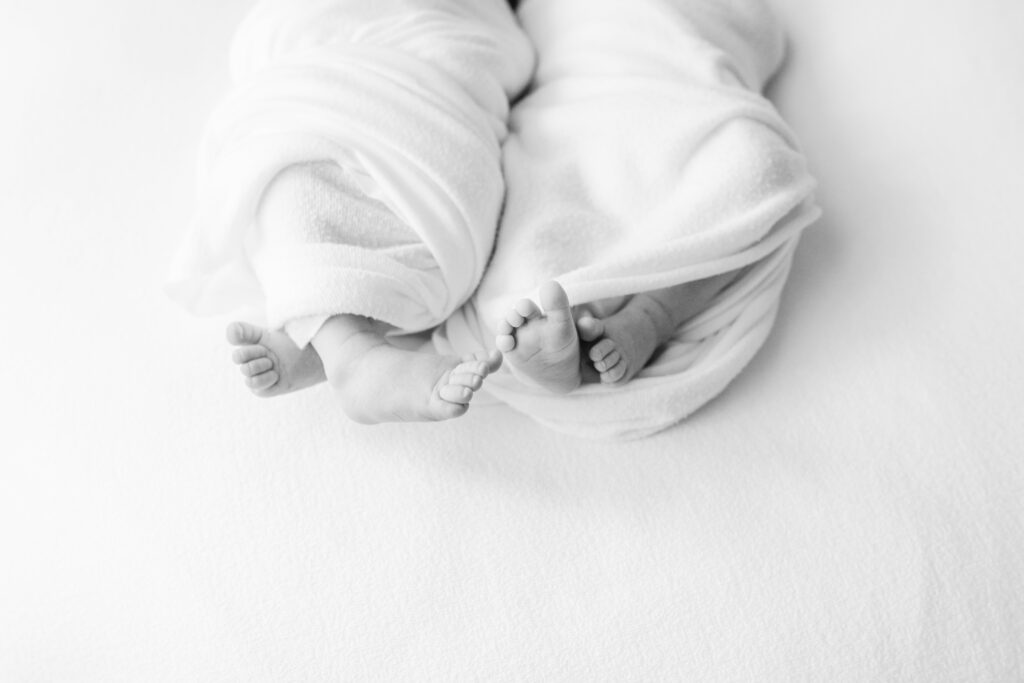 Twin babies feet from newborn photo session in roswell georgia studio.